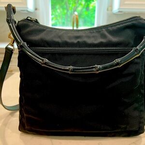 Black Gucci canvas bamboo top handle with removable leather strap.
